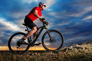 Image showing Mountain Bike cyclist riding single track