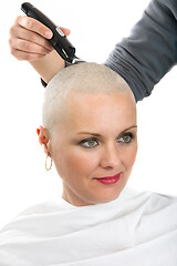 Image showing beautiful middle age woman cancer patient shaving hair