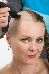 Image showing beautiful middle age woman cancer patient shaving hair