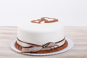 Image showing valentine love cake with hearts on wooden background