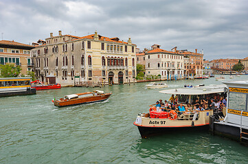 Image showing Venice, Italy. Small passenger ship carries tourists across the city