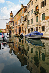 Image showing Venice, Italy. Tourists walking at sidewalks aside to canals in historic part of the city