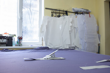 Image showing table for cutting matter in a sewing studio and patterns