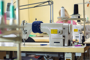 Image showing industrial sewing machine in the workshop of the atelier
