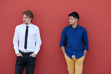 Image showing portrait of multiethnic startup business men in front of pink wa