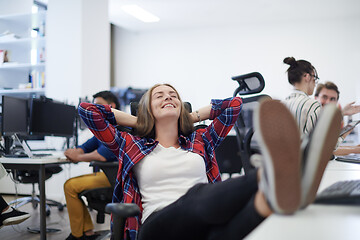 Image showing business woman taking a break from work