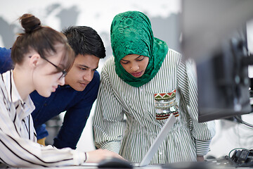 Image showing Multiethnic startup business team with Arabian woman