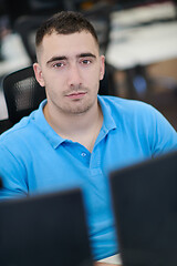 Image showing casual business man working on desktop computer