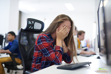 Image showing tired casual business woman taking a break from work