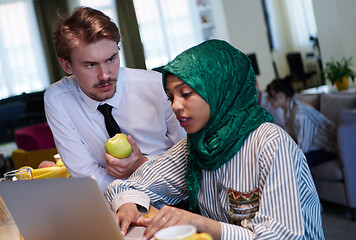 Image showing international multicultural business team working together on la