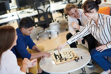 Image showing multiethnic group of business people playing chess