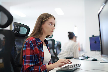 Image showing casual business woman working on desktop computer