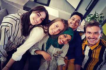 Image showing group of casual multiethnic business people taking selfie