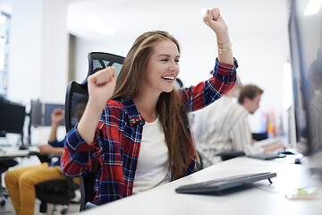 Image showing casual business woman celebrating success