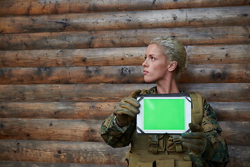 Image showing woman soldier using tablet computer