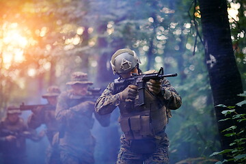 Image showing Modern warfare Soldiers  Squad  in battle