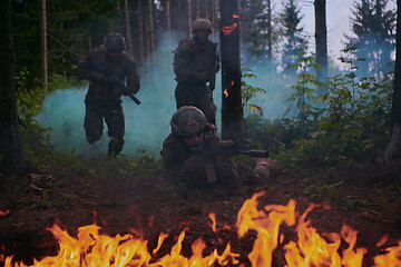 Image showing Modern warfare Soldiers  Squad  in battle