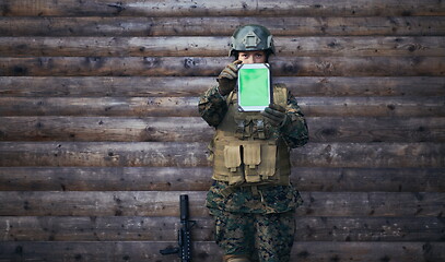 Image showing woman soldier using tablet computer