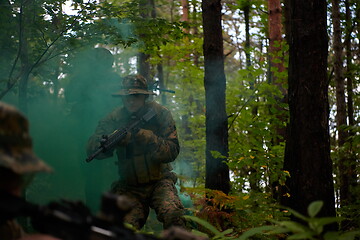 Image showing Modern warfare Soldiers  Squad  in battle