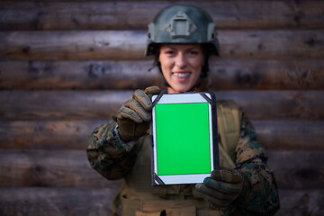 Image showing woman soldier using tablet computer