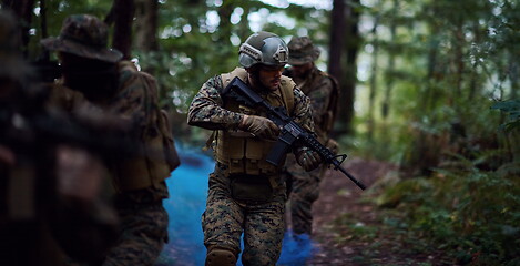 Image showing Modern warfare Soldiers  Squad  in battle