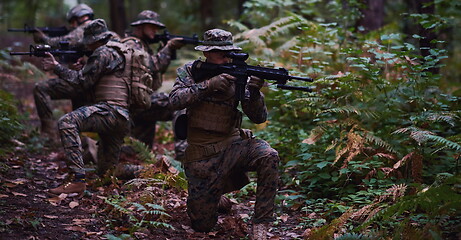 Image showing Modern warfare Soldiers  Squad  in battle