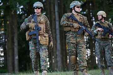 Image showing Modern warfare Soldiers  Squad  in battle