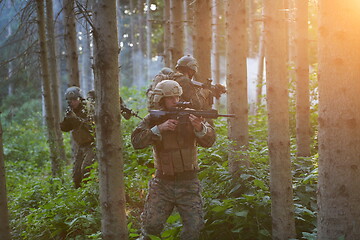 Image showing Modern warfare Soldiers  Squad  in battle