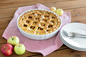 Image showing apple pie in baking mold on wooden table