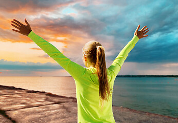 Image showing happy woman in sports clothes at seaside