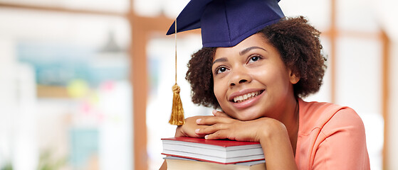 Image showing african american graduate student with books