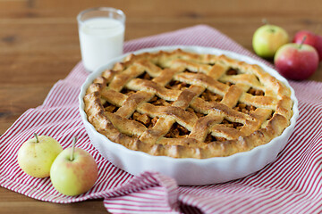 Image showing apple pie in baking mold on wooden table