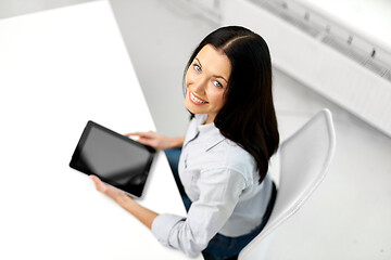 Image showing businesswoman with tablet computer at office