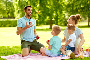 Image showing happy family having picnic at summer park