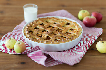 Image showing apple pie in baking mold on wooden table