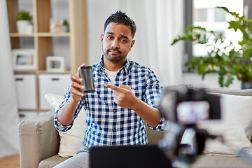 Image showing male blogger with smartphone videoblogging