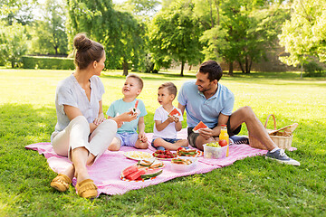Image showing happy family having picnic at summer park