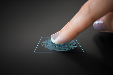 Image showing finger touching black interactive panel