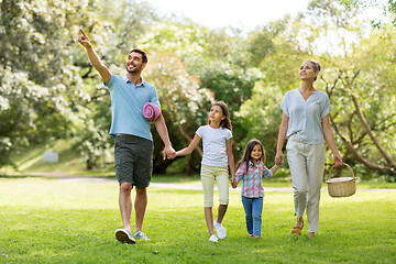 Image showing family with picnic basket walking in summer park