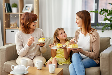 Image showing mother, daughter and grandmother eating cake