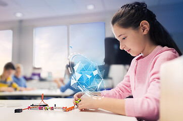 Image showing girl building robot at robotics school