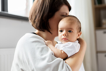 Image showing close up of mother holding her baby