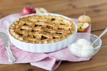 Image showing apple pie with ice cream on wooden table