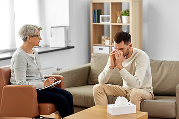 Image showing senior woman psychologist and sad man patient