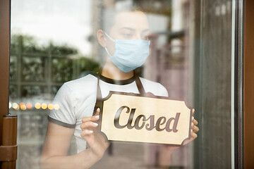 Image showing Closed sign on the glass of street cafe or restaurant