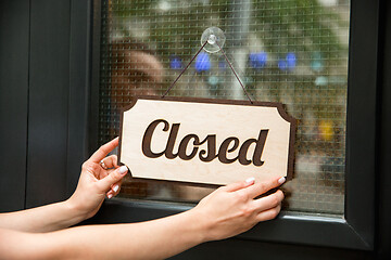 Image showing Closed sign on the glass of street cafe or restaurant