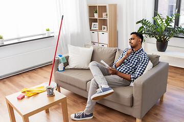 Image showing indian man with to do list after home cleaning