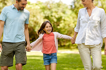 Image showing happy family walking in summer park