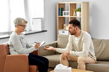 Image showing senior woman psychologist and sad man patient