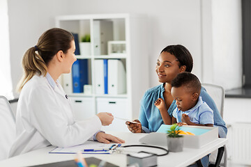 Image showing happy mother with baby son and doctor at clinic